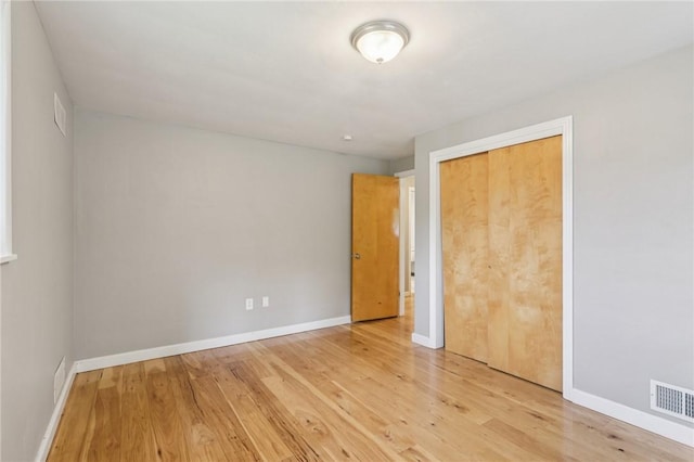 1717 Gina Dr, West Mifflin, PA 15122 - unfurnished bedroom featuring wood finished floors and a closet