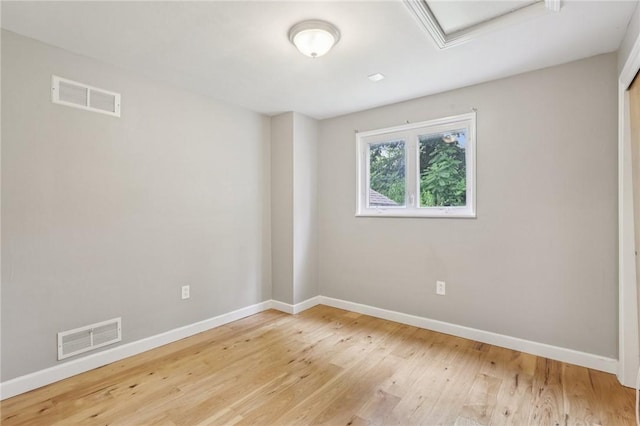 1717 Gina Dr, West Mifflin, PA 15122 - spare room with wood finished floors and attic access