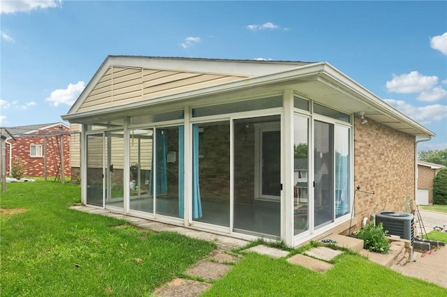 1717 Gina Dr, West Mifflin, PA 15122 - view of side of home featuring a sunroom, a yard, and brick siding