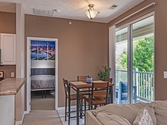 310 Stockton Rdg, Cranberry Twp, PA 16066 - dining area with baseboards and a textured ceiling