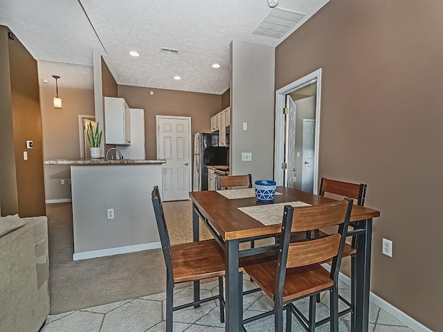 310 Stockton Rdg, Cranberry Twp, PA 16066 - dining space with a textured ceiling, light colored carpet, and recessed lighting