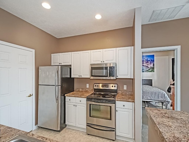 310 Stockton Rdg, Cranberry Twp, PA 16066 - kitchen with appliances with stainless steel finishes and white cabinetry