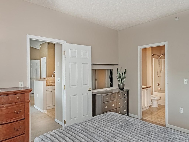 310 Stockton Rdg, Cranberry Twp, PA 16066 - bedroom featuring ensuite bathroom, light colored carpet, and a textured ceiling