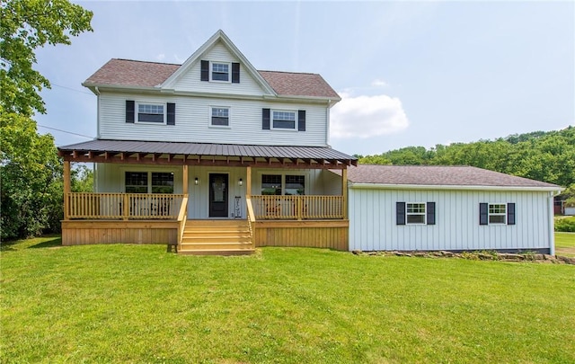 190 Hillview Manor Rd, Gilpin Twp, PA 15656 - view of front facade featuring covered porch, a front lawn, and board and batten siding