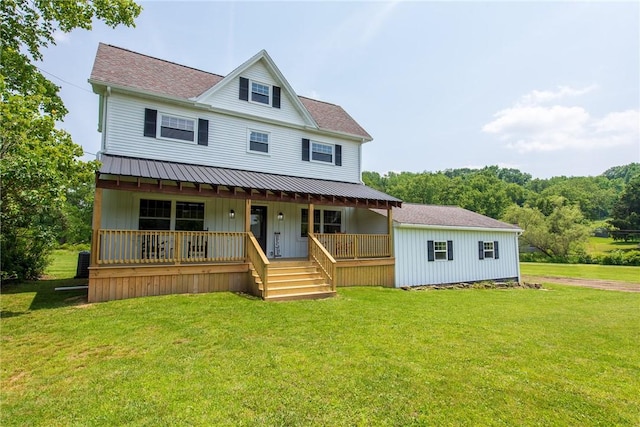 190 Hillview Manor Rd, Gilpin Twp, PA 15656 - view of front of home featuring covered porch, a front lawn, and board and batten siding