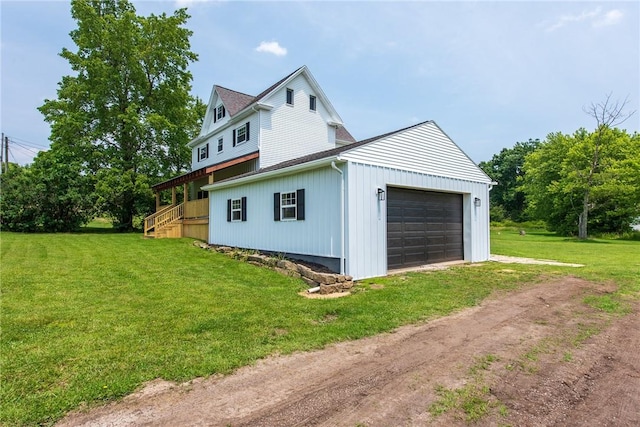 190 Hillview Manor Rd, Gilpin Twp, PA 15656 - view of side of home featuring driveway, a yard, and a garage