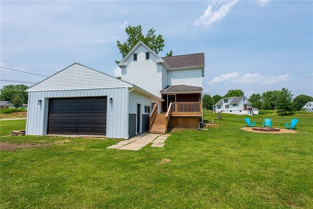 190 Hillview Manor Rd, Gilpin Twp, PA 15656 - back of property with stairway, an outbuilding, a lawn, board and batten siding, and a garage