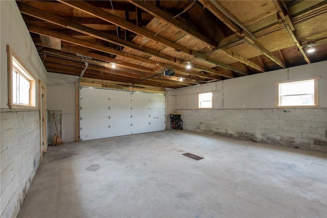 190 Hillview Manor Rd, Gilpin Twp, PA 15656 - garage with a garage door opener and concrete block wall
