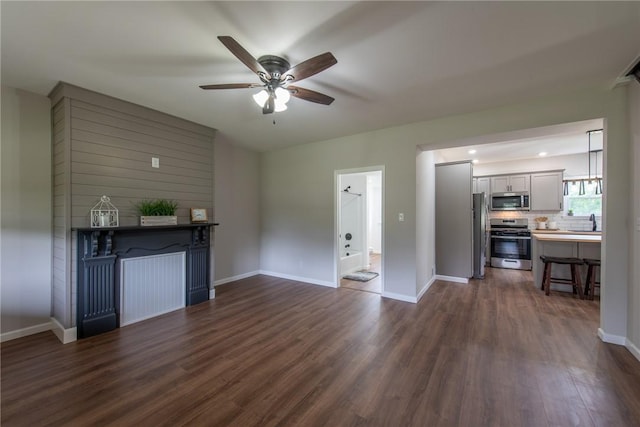 190 Hillview Manor Rd, Gilpin Twp, PA 15656 - unfurnished living room with dark wood-style floors and ceiling fan