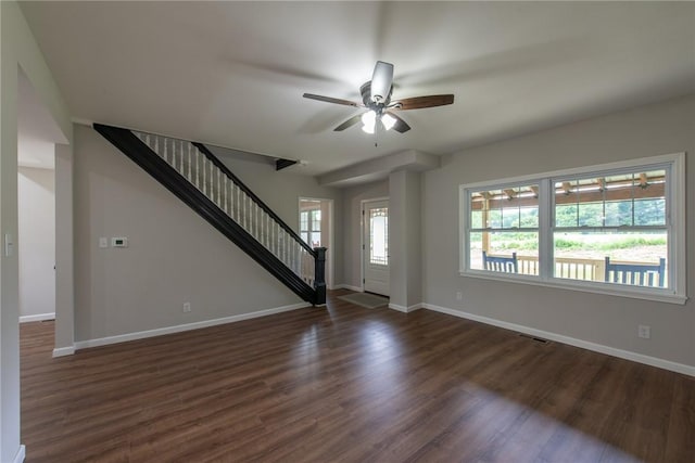 190 Hillview Manor Rd, Gilpin Twp, PA 15656 - unfurnished living room with stairs, dark wood-style floors, healthy amount of natural light, and ceiling fan