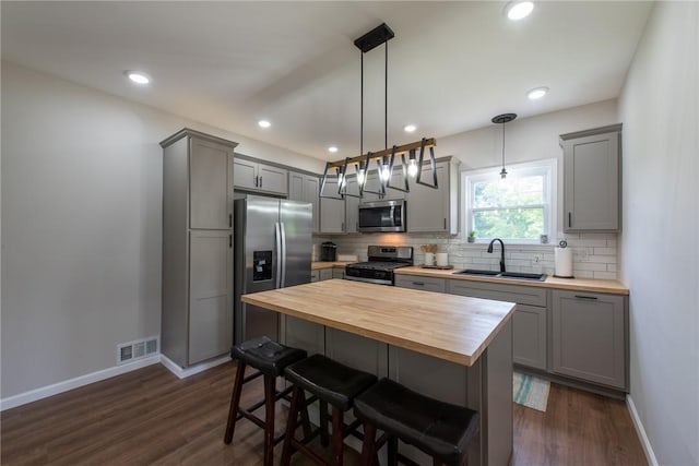 190 Hillview Manor Rd, Gilpin Twp, PA 15656 - kitchen featuring wooden counters, stainless steel appliances, gray cabinets, decorative backsplash, and recessed lighting