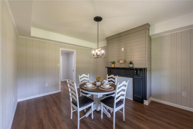 190 Hillview Manor Rd, Gilpin Twp, PA 15656 - dining area with a chandelier, wood finished floors, and wood walls