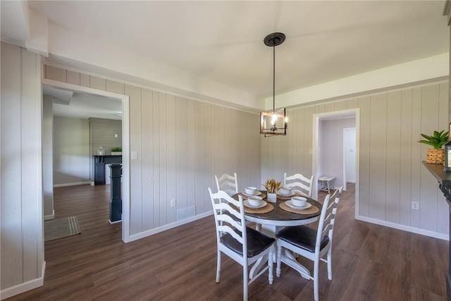 190 Hillview Manor Rd, Gilpin Twp, PA 15656 - dining area featuring dark wood-style floors and wooden walls