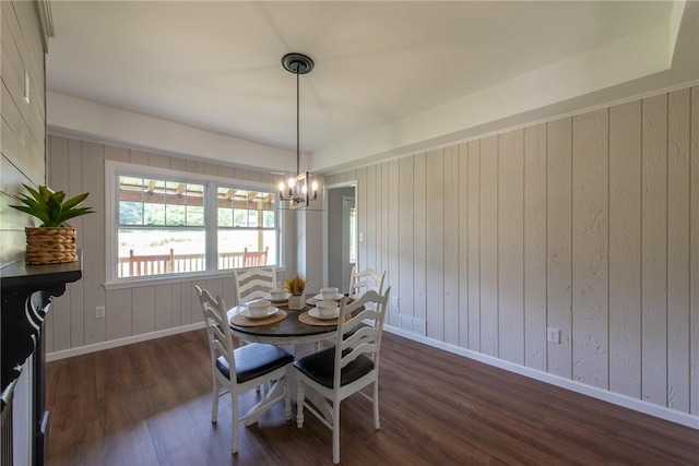 190 Hillview Manor Rd, Gilpin Twp, PA 15656 - dining area with dark wood-style floors, a chandelier, and wood walls