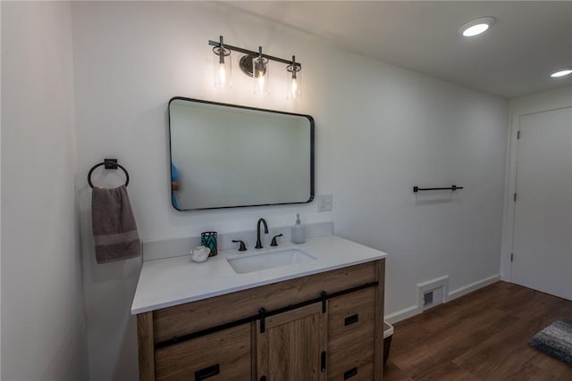 190 Hillview Manor Rd, Gilpin Twp, PA 15656 - bathroom featuring vanity, wood finished floors, and recessed lighting