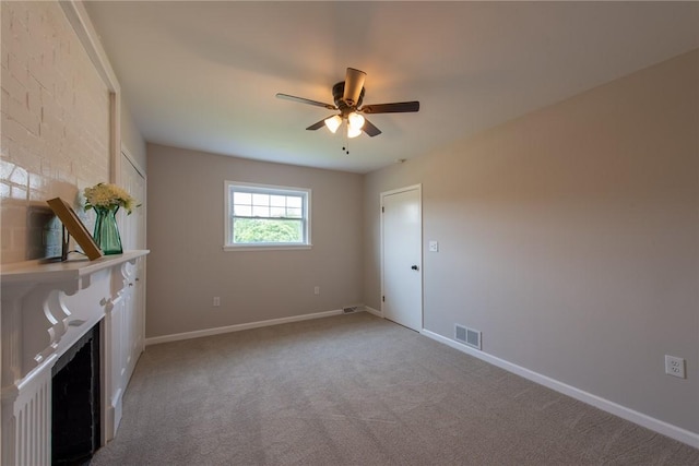 190 Hillview Manor Rd, Gilpin Twp, PA 15656 - unfurnished living room featuring a ceiling fan, light colored carpet, and a fireplace