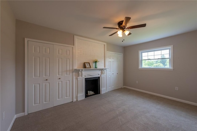 190 Hillview Manor Rd, Gilpin Twp, PA 15656 - unfurnished living room featuring a fireplace, a ceiling fan, and carpet flooring