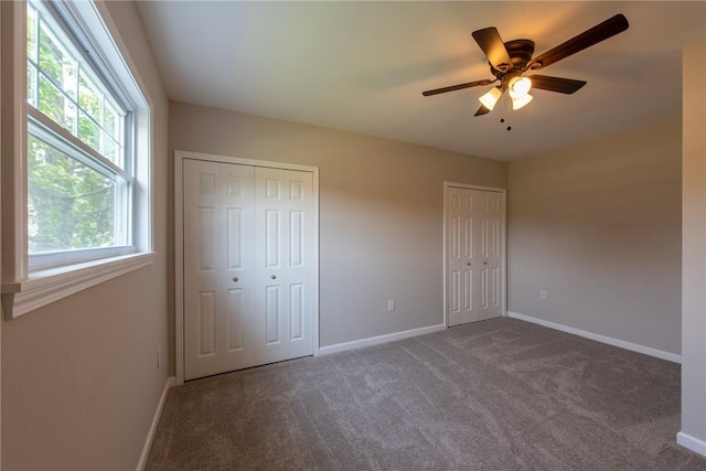 190 Hillview Manor Rd, Gilpin Twp, PA 15656 - unfurnished bedroom with multiple closets, carpet flooring, and a ceiling fan