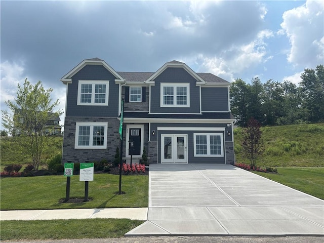 116 Mesa Dr, Moon/Crescent Twp, PA 15108 - view of front of house with a front yard, stone siding, and concrete driveway