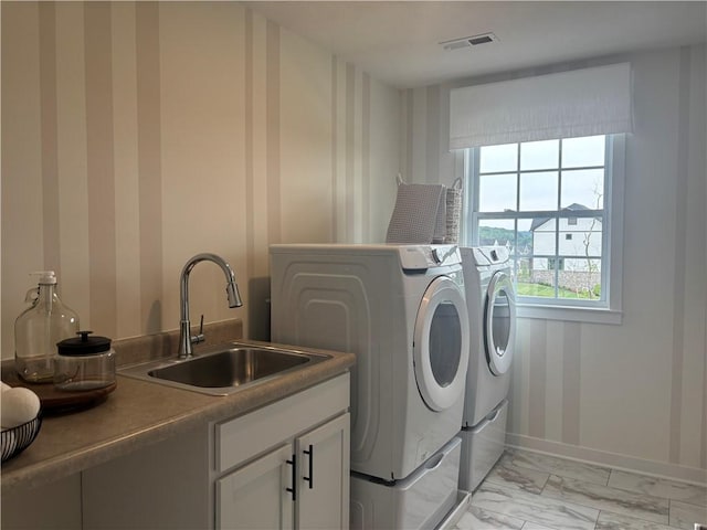 116 Mesa Dr, Moon/Crescent Twp, PA 15108 - laundry area featuring washer and clothes dryer, wallpapered walls, cabinet space, and light marble finish floors