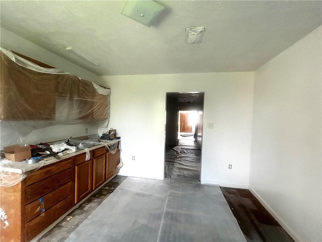 1411 Walnut Ave, Monessen, PA 15062 - kitchen featuring brown cabinets and light countertops
