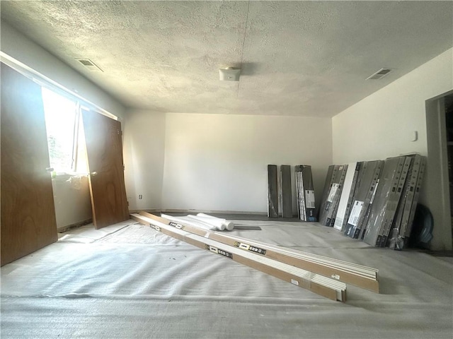1411 Walnut Ave, Monessen, PA 15062 - unfurnished bedroom with a textured ceiling and carpet flooring