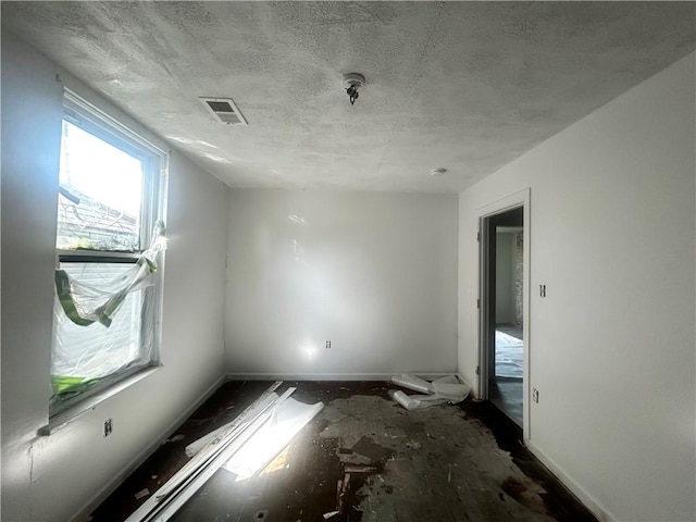 1411 Walnut Ave, Monessen, PA 15062 - empty room with baseboards and a textured ceiling