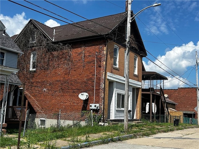 1411 Walnut Ave, Monessen, PA 15062 - view of property exterior with brick siding and a shingled roof