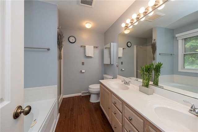314 Westburn Ct, Seven Fields Boro, PA 16046 - bathroom featuring a stall shower, a garden tub, double vanity, and wood finished floors
