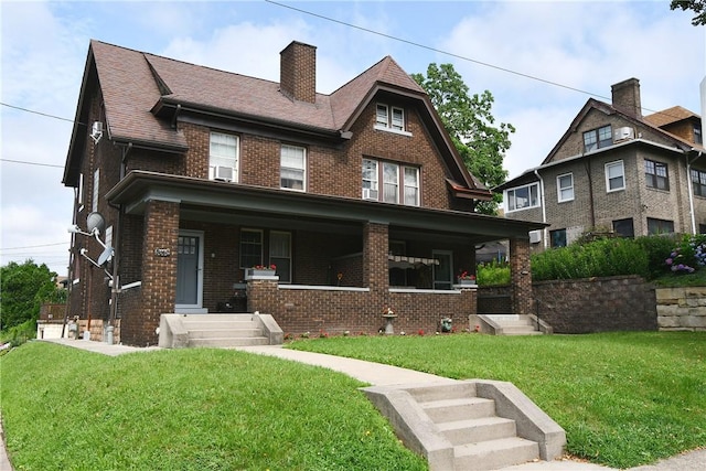 2464-2466 Beechwood Blvd, Squirrel Hill, PA 15217 - view of front of home with brick siding, a front lawn, a chimney, and a porch