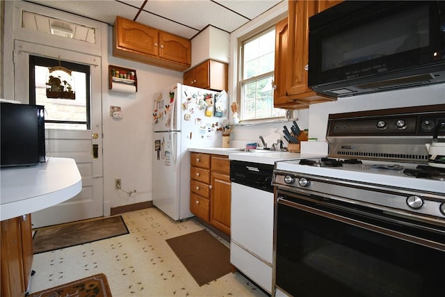 2464-2466 Beechwood Blvd, Squirrel Hill, PA 15217 - kitchen featuring white appliances, brown cabinets, light countertops, and light floors