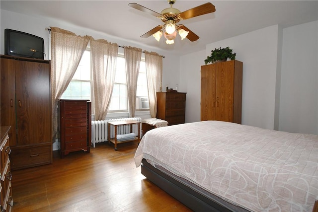 2464-2466 Beechwood Blvd, Squirrel Hill, PA 15217 - bedroom with wood finished floors, radiator heating unit, and ceiling fan