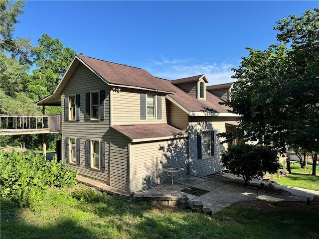 108 Hill St, Coaldale, PA 16679 - view of side of home featuring a shingled roof, a patio, and a balcony