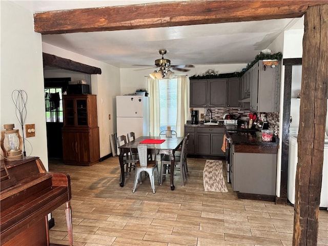 108 Hill St, Coaldale, PA 16679 - dining room with light wood-style flooring, a ceiling fan, and beam ceiling
