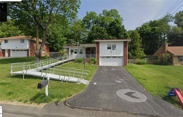 110 Marian Ave, Shaler, PA 15116 - tri-level home featuring asphalt driveway, brick siding, and an attached garage