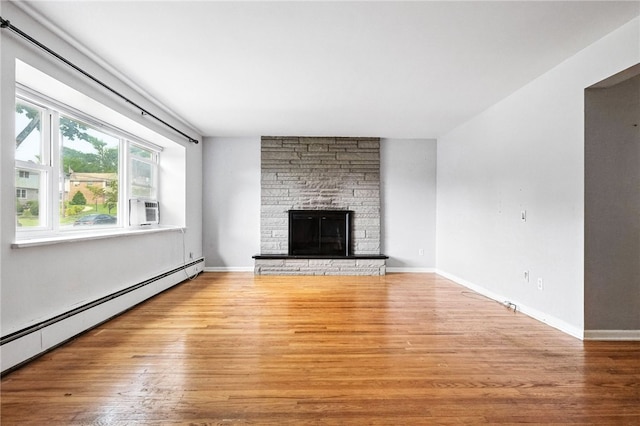 110 Marian Ave, Shaler, PA 15116 - unfurnished living room with a baseboard radiator, light wood-style floors, a stone fireplace, and cooling unit