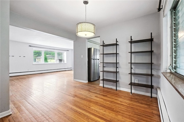 110 Marian Ave, Shaler, PA 15116 - spare room featuring a baseboard heating unit and light wood-style flooring