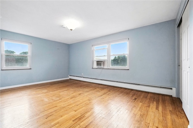 110 Marian Ave, Shaler, PA 15116 - spare room featuring baseboard heating, hardwood / wood-style floors, and cooling unit