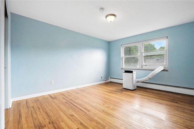 110 Marian Ave, Shaler, PA 15116 - spare room with baseboard heating, wood finished floors, and a smoke detector