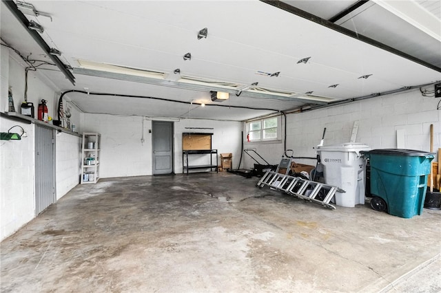 110 Marian Ave, Shaler, PA 15116 - garage with a garage door opener and concrete block wall