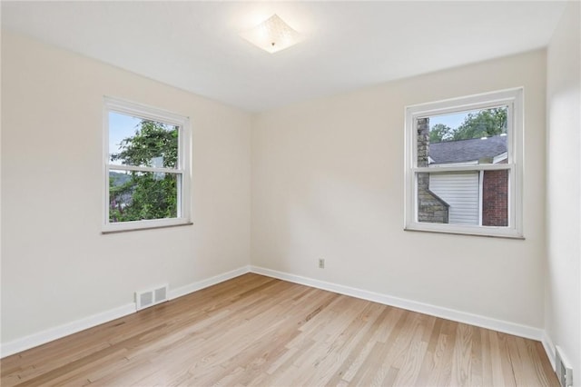 106 Crestline Dr, Ross Twp, PA 15237 - empty room featuring healthy amount of natural light and light wood-style flooring