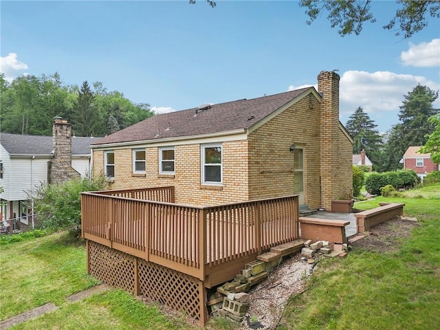 106 Crestline Dr, Ross Twp, PA 15237 - back of house featuring brick siding, a chimney, a yard, a deck, and roof with shingles