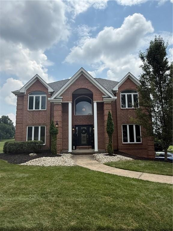 3005 E Ridge Dr, Pine Twp, PA 15044 - view of front of property with brick siding, a front yard, and roof with shingles