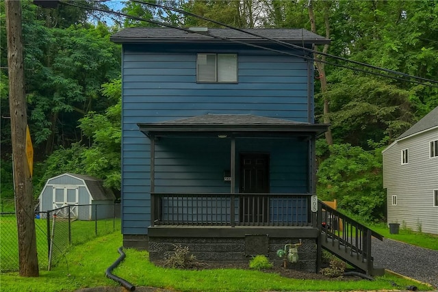 505 Bellwood Rd, West Mifflin, PA 15122 - rear view of house featuring a storage shed, covered porch, stairway, and roof with shingles