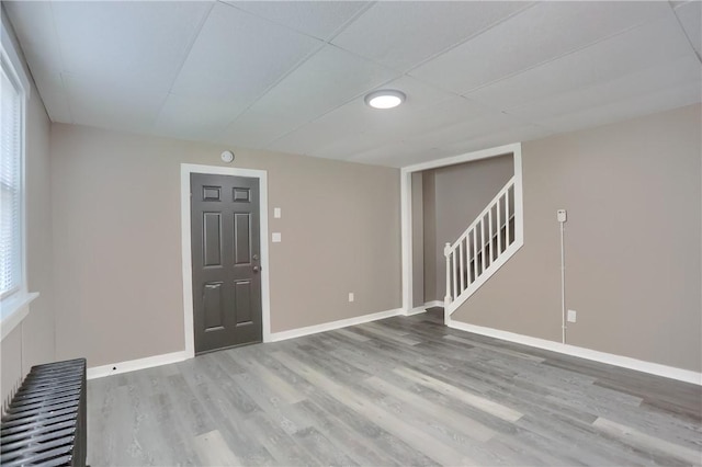 505 Bellwood Rd, West Mifflin, PA 15122 - unfurnished room featuring wood finished floors and stairs