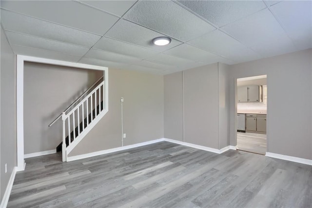 505 Bellwood Rd, West Mifflin, PA 15122 - empty room featuring wood finished floors, stairs, and a paneled ceiling