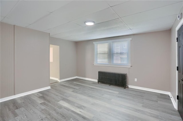 505 Bellwood Rd, West Mifflin, PA 15122 - unfurnished living room with radiator heating unit and wood finished floors