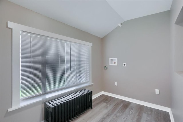 505 Bellwood Rd, West Mifflin, PA 15122 - laundry room featuring radiator heating unit, electric dryer hookup, hookup for a washing machine, and wood finished floors