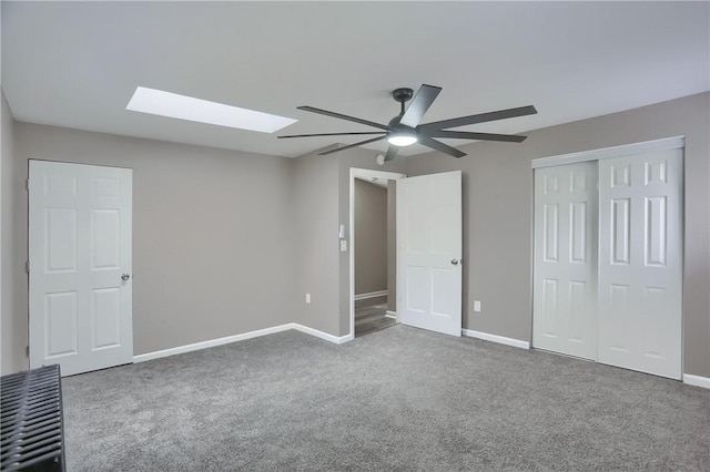505 Bellwood Rd, West Mifflin, PA 15122 - unfurnished bedroom featuring a skylight, carpet floors, a closet, and ceiling fan