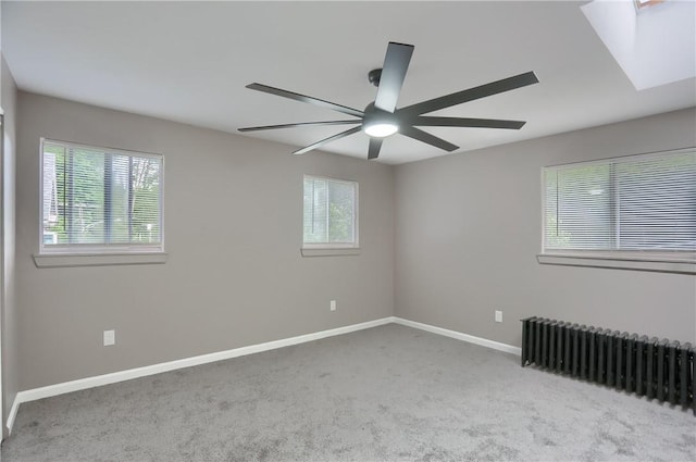 505 Bellwood Rd, West Mifflin, PA 15122 - carpeted empty room with radiator heating unit, healthy amount of natural light, and ceiling fan